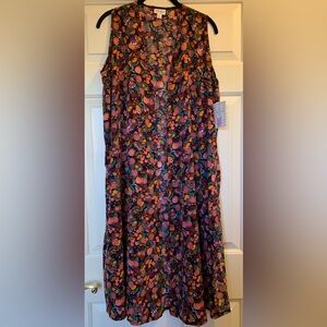 Medium LuLaRoe Joy with Navy Background and a Colorful Floral Design.